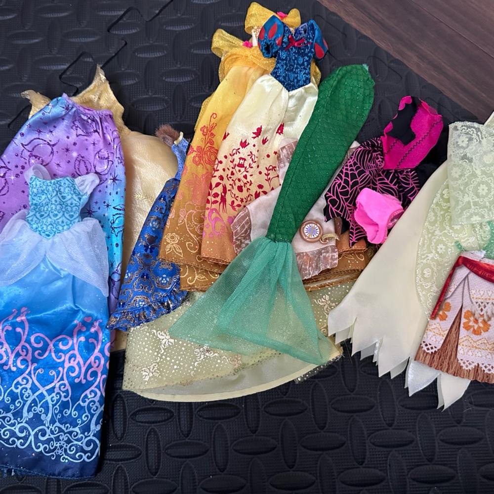 Assorted Disney doll/barbie clothes.